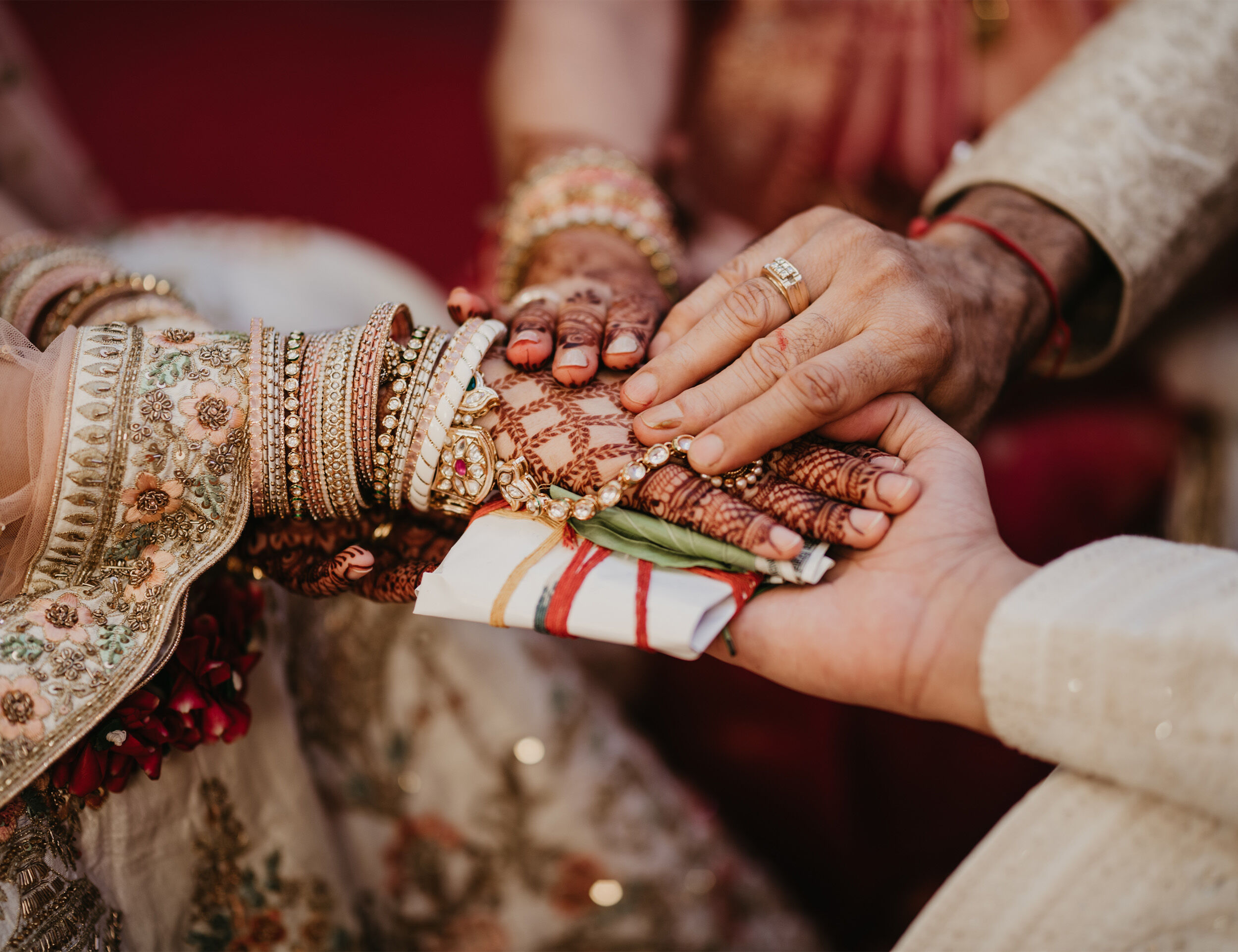 Intercultural wedidng ideas a handkerchief bitween bride and grooms hand
